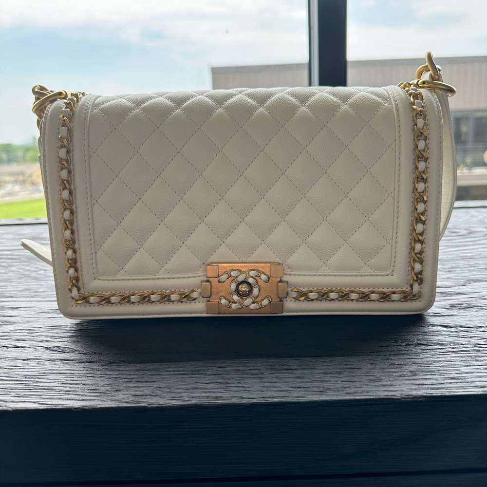 Brand new never used Chanel medium boy bag in white caviar leather.